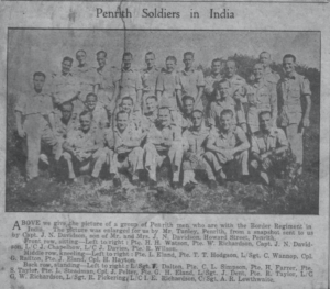 Penrith Soldiers in India. Front row sitting – Left to right: Pte. H.H. Watson, Pte. W. Richardson, Capt. J.N. Davidson, L/C J. Chapelhow, L/C J. Davies, Pte R. Wilson. Midde Row, kneeling – Left to right: Pte. L. Eland, Pte. T.T. Hodson, L/Sgt. C. Wannop, Cpl. G. Railton, Pte. J. Eland, Cpl. H. Hayton. Back Row, standing – Left to right: L/Sgt J. Dalton, Pte. C.L. Simpson, Pte. H. Farrer, Pte. S. Taylor, Pte. L. Steadman, Cpl. J. Pelter, Pte. G.H. Eland, L/Sgt J. Dent, Pte. R. Taylor, L/C G.W. Richardson, L/Sgt. R. Pickering, L/CI. E. Richardson, C/Sgt A.R. Lewthwaite.